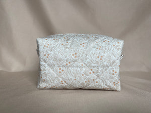 the neutral florals makeup bags